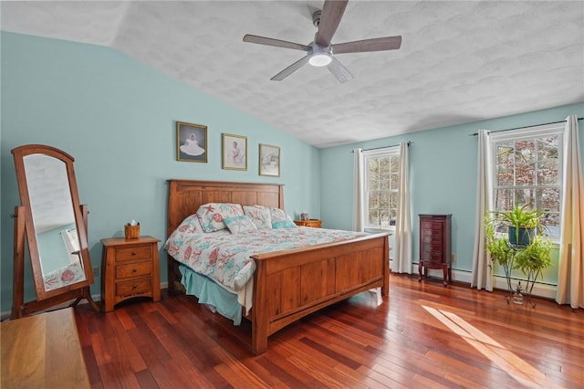 bedroom featuring lofted ceiling, dark wood-type flooring, and ceiling fan