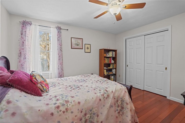 bedroom featuring hardwood / wood-style floors, ceiling fan, and a closet