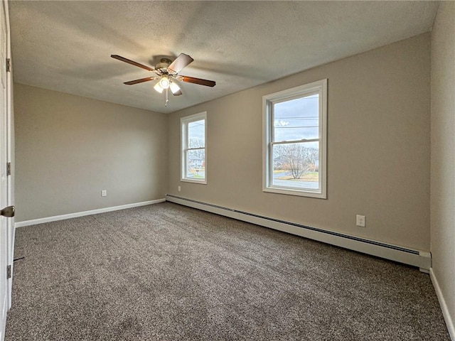 carpeted spare room featuring ceiling fan, a baseboard radiator, and a textured ceiling