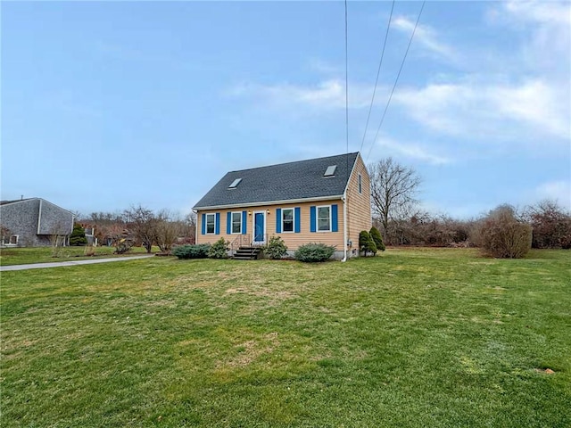 cape cod home featuring a front lawn