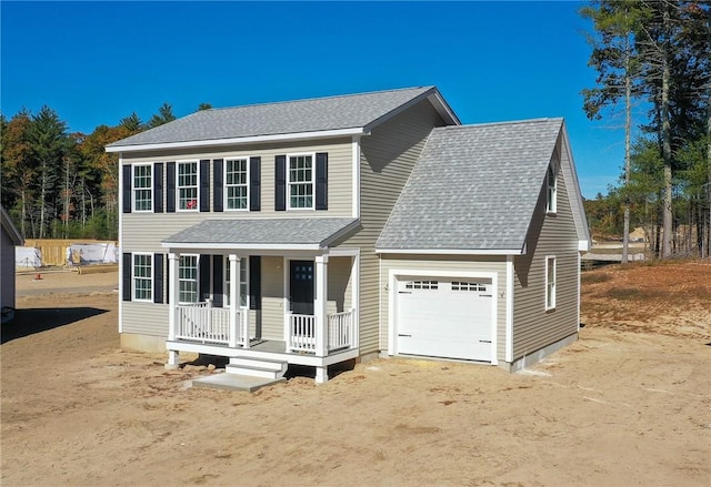 view of front of house featuring a garage and covered porch