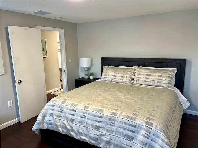 bedroom featuring dark hardwood / wood-style floors