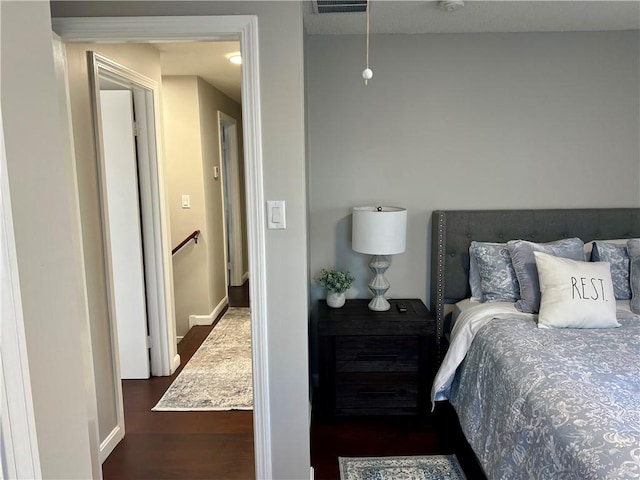 bedroom featuring dark hardwood / wood-style floors