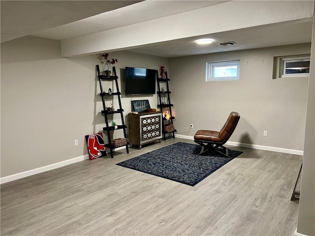 sitting room with hardwood / wood-style flooring