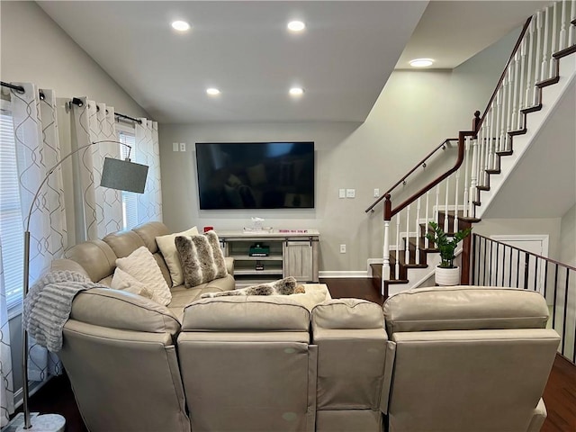 living room featuring hardwood / wood-style floors and vaulted ceiling