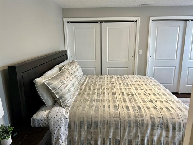 bedroom with two closets