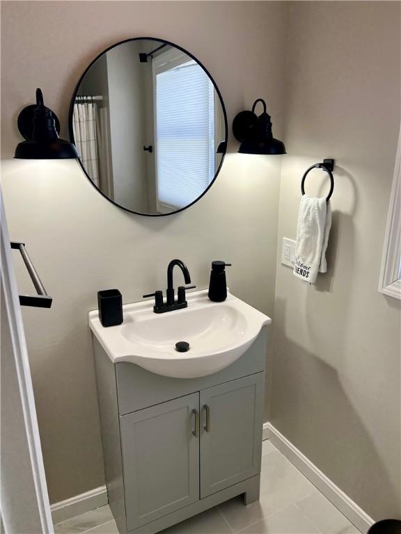 bathroom featuring tile patterned floors and vanity