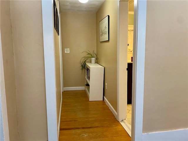 hall with light hardwood / wood-style floors