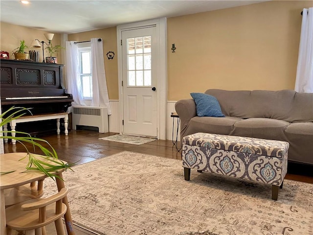 living room featuring dark hardwood / wood-style floors and radiator