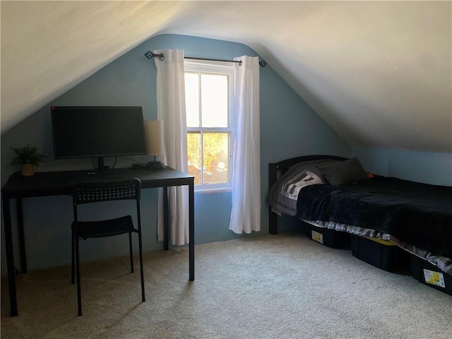 bedroom with light colored carpet, vaulted ceiling, and multiple windows