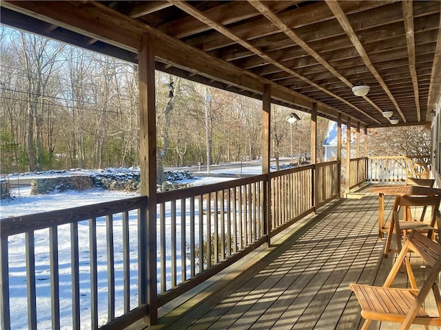 view of snow covered deck