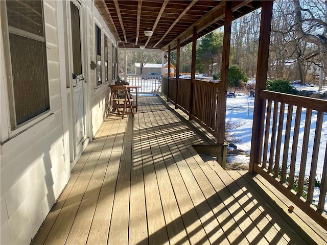 view of snow covered deck