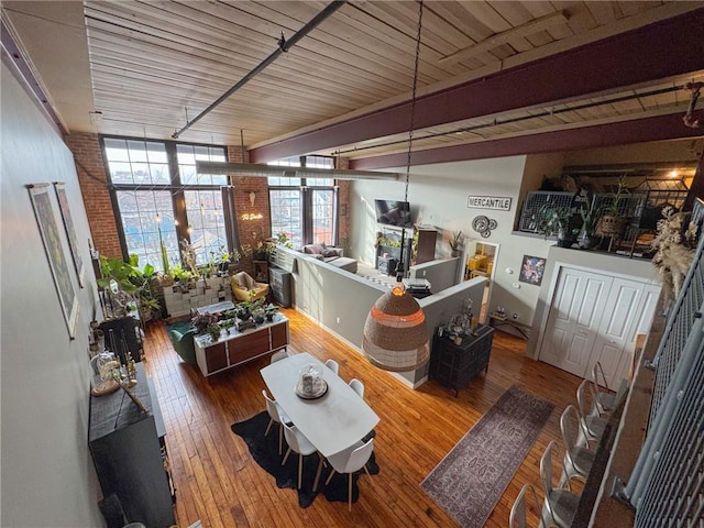 living room with expansive windows and wood-type flooring