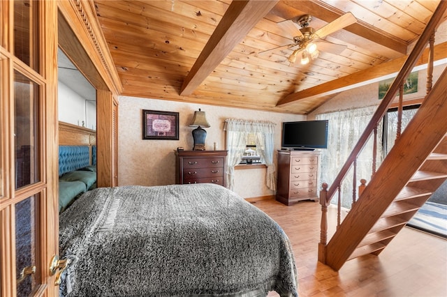 bedroom featuring vaulted ceiling with beams, ceiling fan, wood ceiling, and light hardwood / wood-style flooring