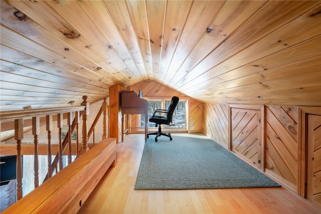 additional living space with wooden walls, wood ceiling, vaulted ceiling, and hardwood / wood-style flooring