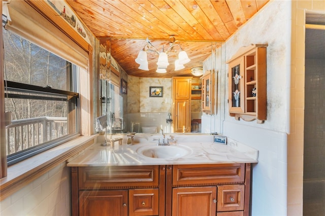 bathroom featuring vanity, wooden ceiling, and an inviting chandelier