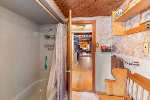 bathroom with shower / bathtub combination with curtain and wood ceiling