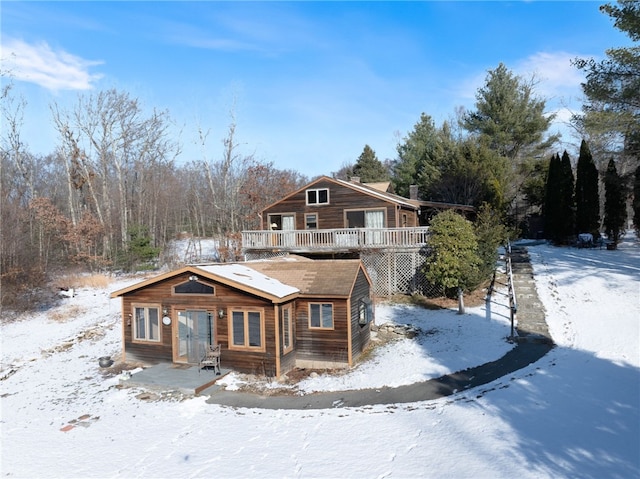 log-style house with a deck