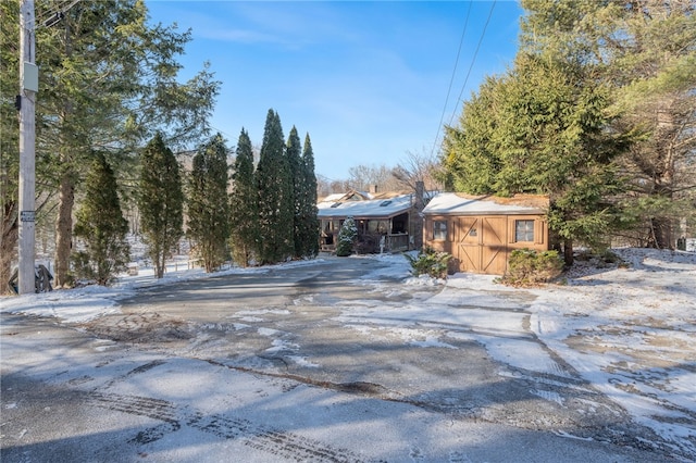 view of front of house with a storage unit