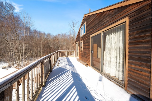 view of snow covered deck