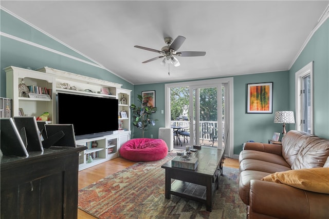 living room featuring hardwood / wood-style flooring, vaulted ceiling, ceiling fan, and ornamental molding