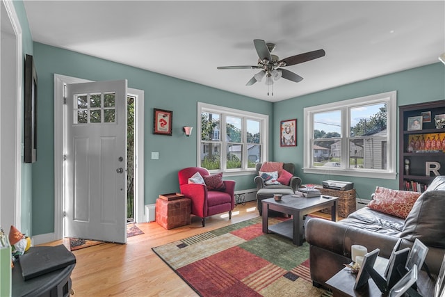 living room featuring hardwood / wood-style flooring and ceiling fan