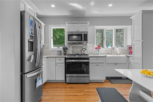 kitchen featuring white cabinetry and appliances with stainless steel finishes