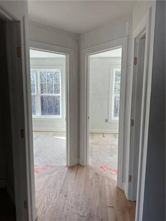 hallway with light wood-type flooring