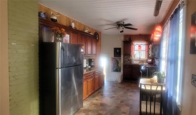 kitchen with ceiling fan and stainless steel refrigerator