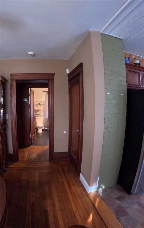 hall with dark hardwood / wood-style floors