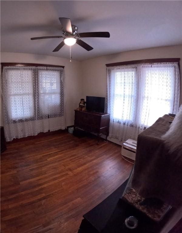 interior space featuring dark hardwood / wood-style flooring and ceiling fan