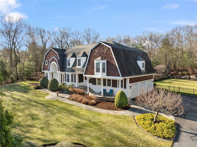 view of front of home featuring a garage and a front yard