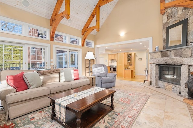 living room featuring a stone fireplace, high vaulted ceiling, wooden ceiling, and beamed ceiling