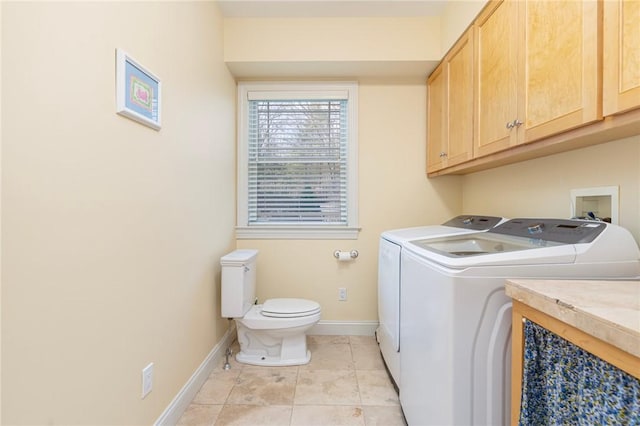 laundry area with light tile patterned flooring and independent washer and dryer