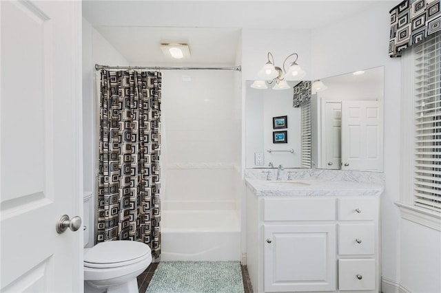 full bathroom featuring vanity, shower / bathtub combination with curtain, tile patterned floors, and toilet