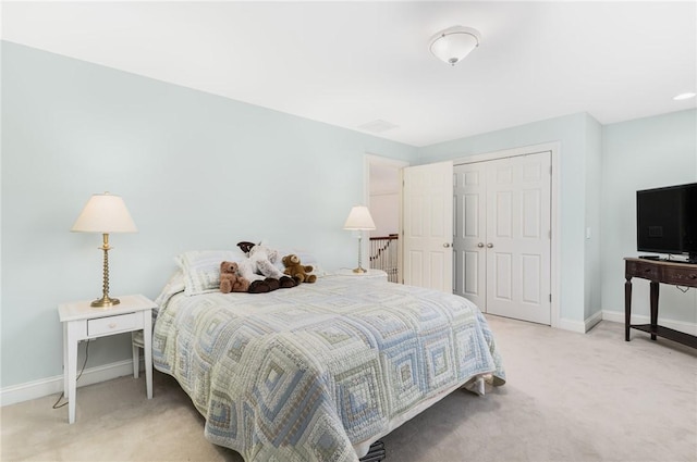 carpeted bedroom featuring a closet