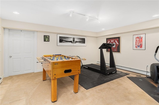 rec room with track lighting and light colored carpet