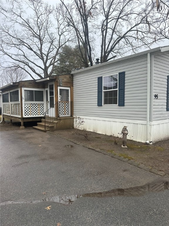 view of front of home featuring a sunroom