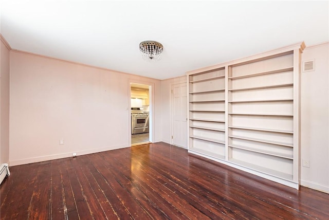 interior space with hardwood / wood-style floors, baseboard heating, and ornamental molding