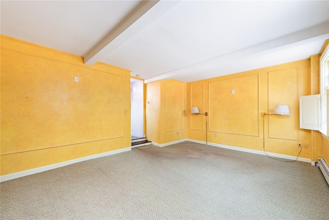 carpeted empty room with beamed ceiling