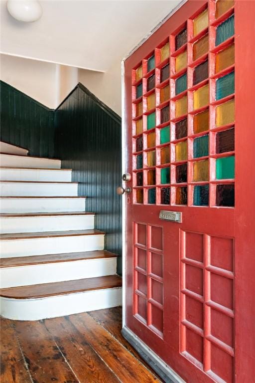 stairway with wood-type flooring