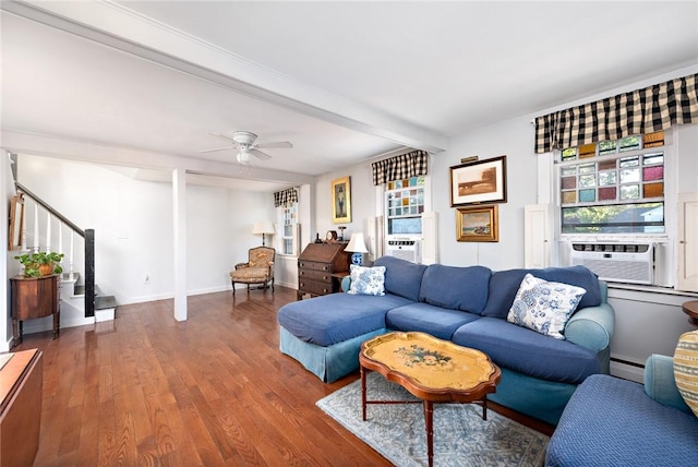 living room featuring a baseboard heating unit, cooling unit, ceiling fan, beam ceiling, and wood-type flooring