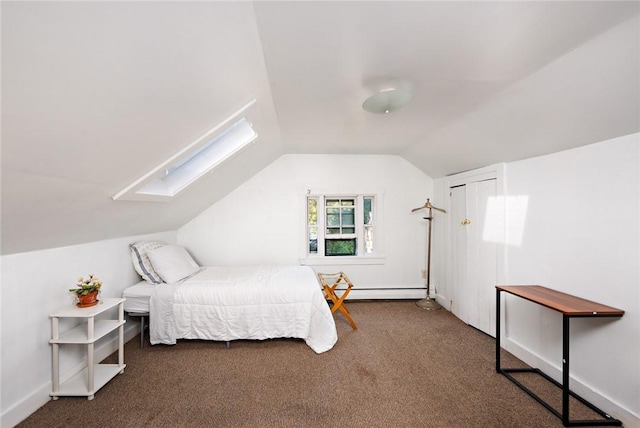 carpeted bedroom featuring lofted ceiling with skylight and a baseboard radiator