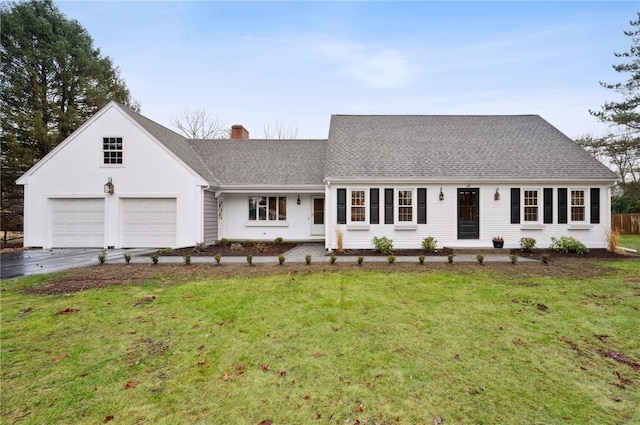 ranch-style house with a garage and a front yard