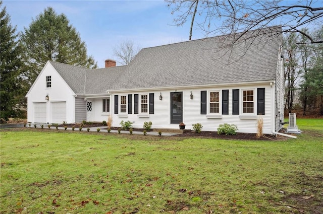 cape cod home featuring central AC unit, a front yard, and a garage