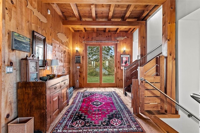 1635 Isabella Beach Rd, Southold, NY 06390 - foyer entrance with wooden ceiling with exposed beams, wooden walls, wood finished floors, and stairway