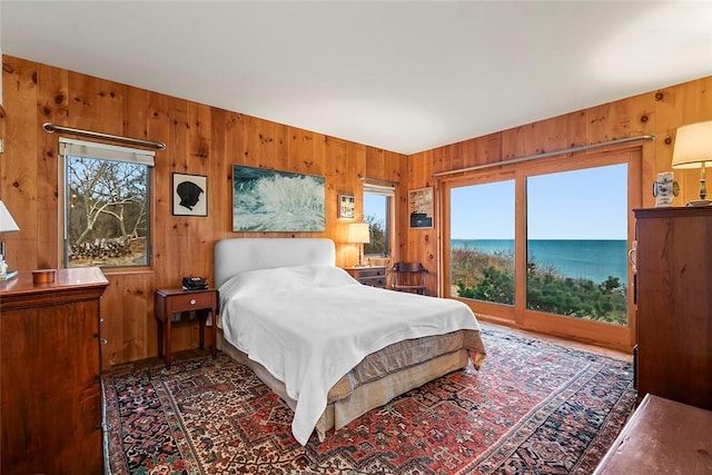 1635 Isabella Beach Rd, Southold, NY 06390 - bedroom featuring wood walls and access to exterior
