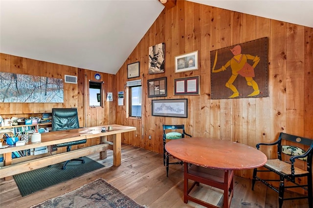 1635 Isabella Beach Rd, Southold, NY 06390 - office space featuring wood walls, lofted ceiling, and hardwood / wood-style floors