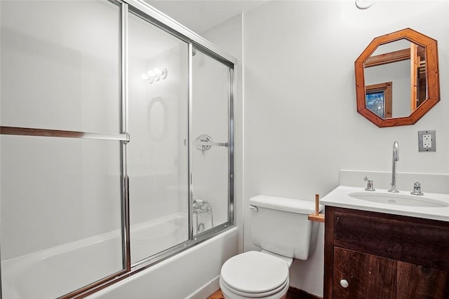 1635 Isabella Beach Rd, Southold, NY 06390 - full bathroom with toilet, vanity, and bath / shower combo with glass door