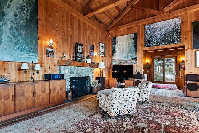 1635 Isabella Beach Rd, Southold, NY 06390 - living area with wooden walls, wooden ceiling with exposed beams, high vaulted ceiling, and a fireplace